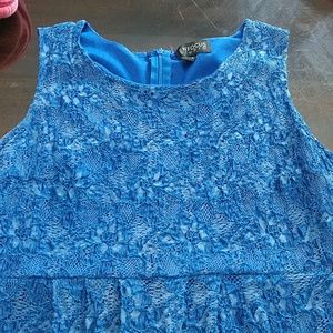 A blue dress with flowers on it